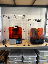 Formlabs 4 and Formlabs 3 enclosures side by side.